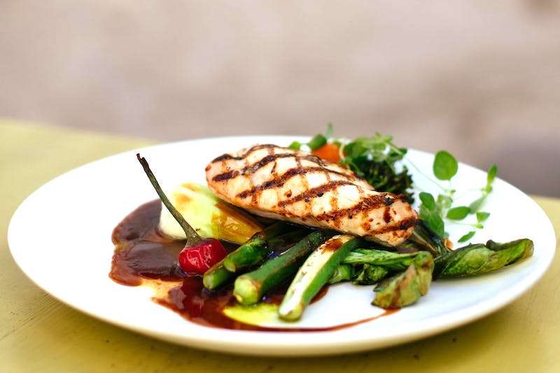 A delicious healthy meal of chicken with fresh steamed vegetables